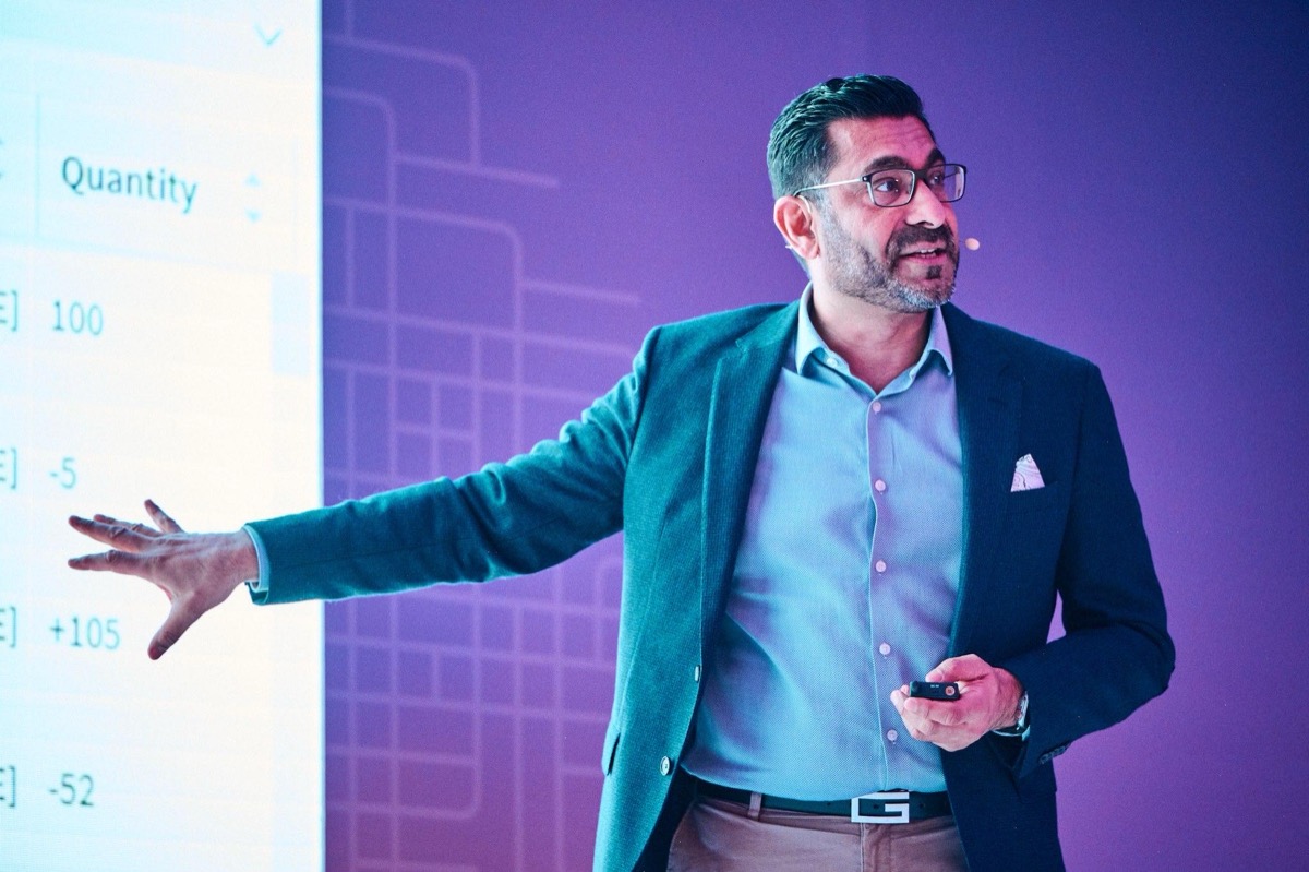 Vijay Jaswal, Founder and CEO of Kudo Advisory, presenting AI strategy at a conference